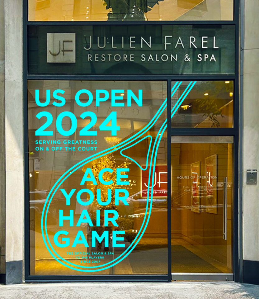Julien Farel Restore Salon & Spa storefront brand campaign with US Open 2024 promotion. The window display reads 'Ace Your Hair Game' in neon blue text with a tennis racket design. Brand campaign by PlanetFab Studio.