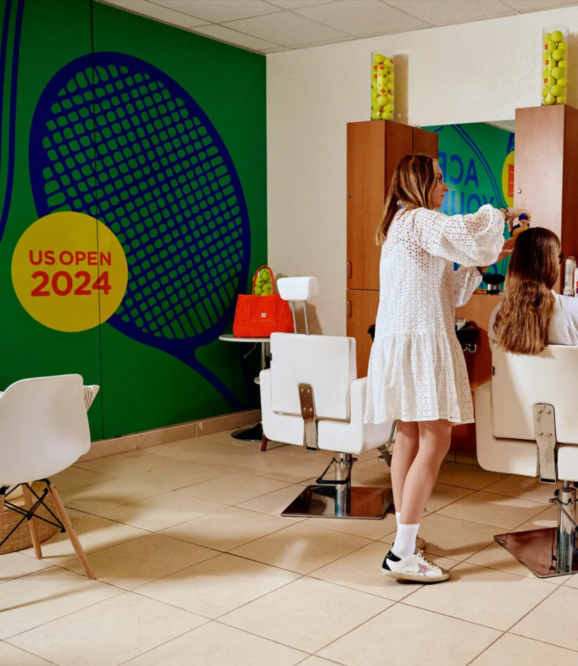 Julien Farel US Open 2024 salon interior with tennis-themed decor and stylist at work.