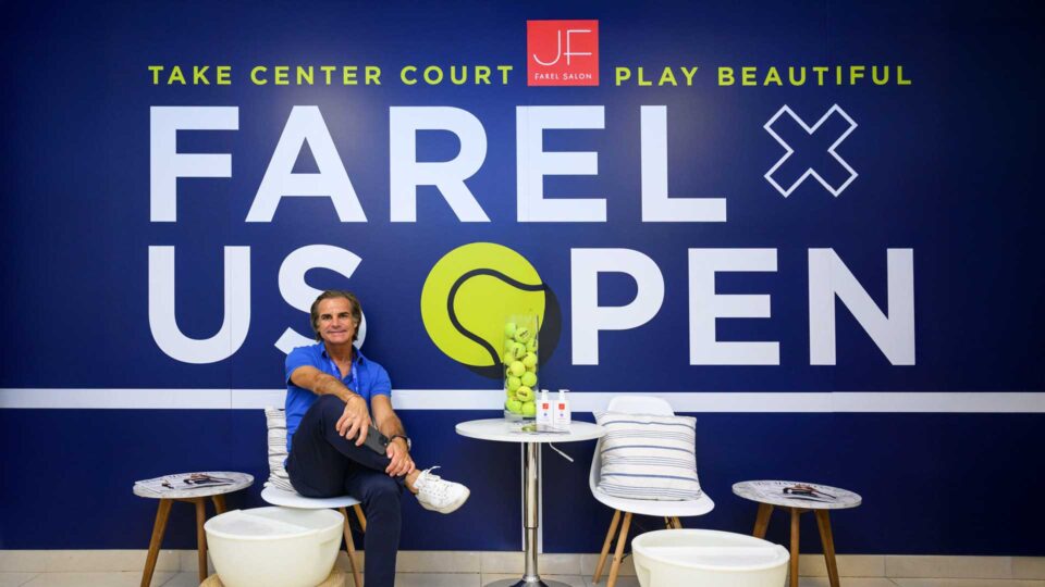 Julien Farel at the US Open 2025 branded popup wall inside Arthur Ashe Stadium, designed by PlanetFab