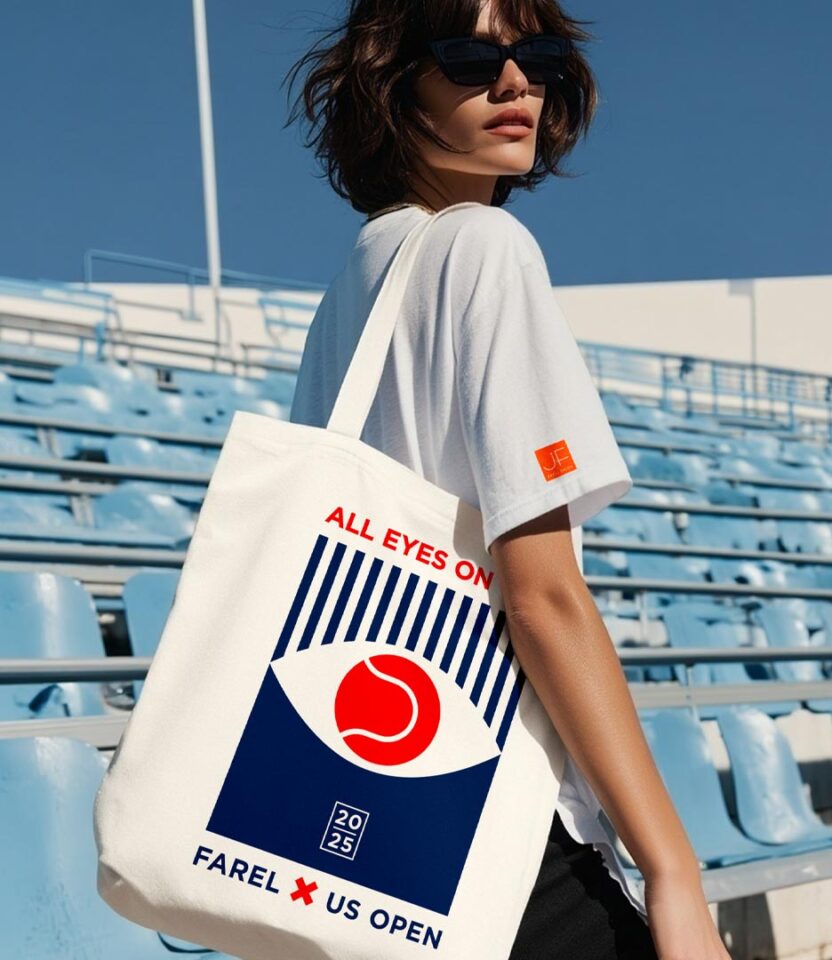 Model carrying PlanetFab Studio's Julien Farel US Open 2025 branding campaign 'All Eyes on You' tote bag