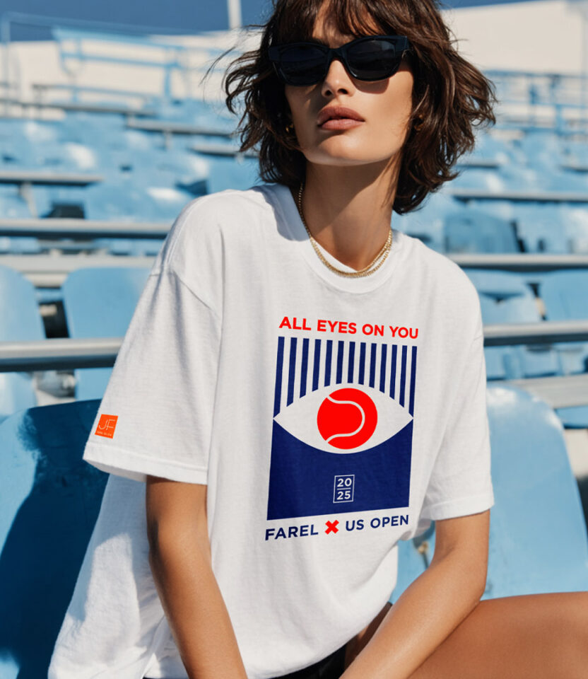 Model wearing PlanetFab Studio's Julien Farel US Open 2025 branding campaign limited-edition T-shirt with 'All Eyes on You' graphic