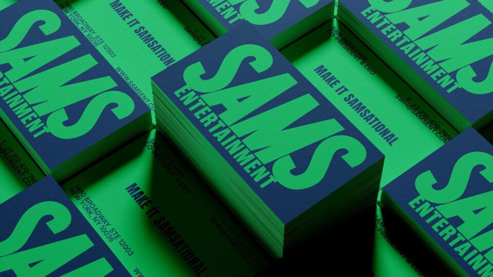 Stacked SAMS Entertainment business cards in navy and green designed by PlanetFab