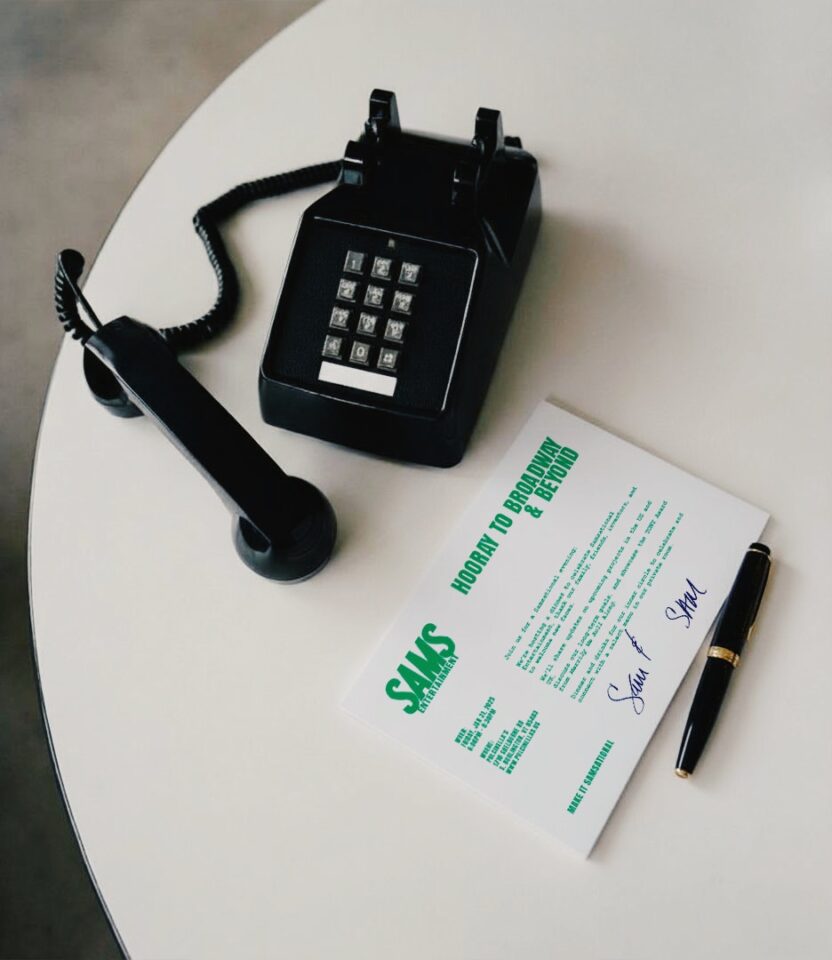 Invitation card with SAMS Entertainment Broadway branding next to a phone