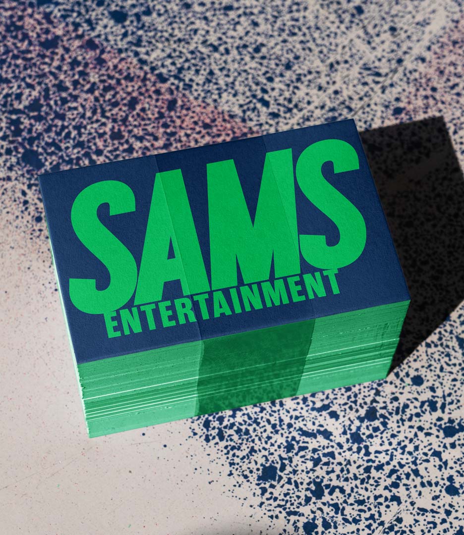 Vertical Sams Entertainment business card in navy and green