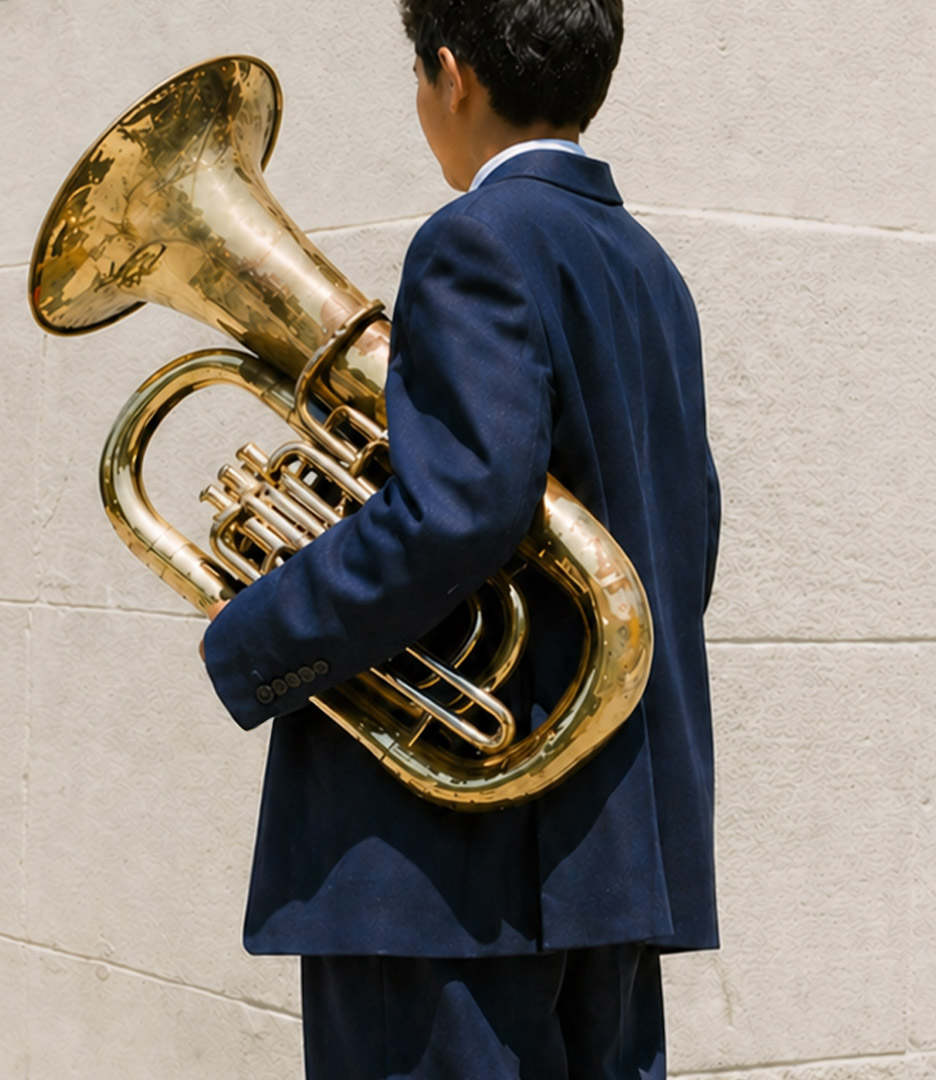Student with brass tuba, WHIN Music Community Charter School case study by Planetfab.