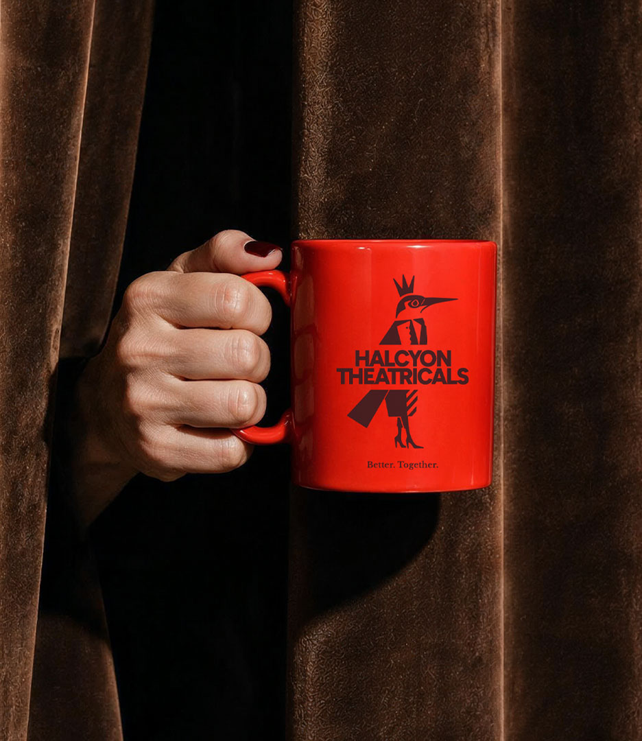 Red Halcyon Theatricals coffee mug featuring the bird emblem, company wordmark and Better. Together. brand message.