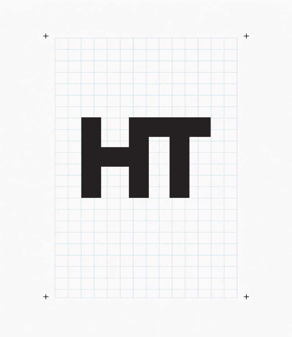 Halcyon Theatricals HT monogram shown on a construction grid illustrating the geometry of the brand mark.